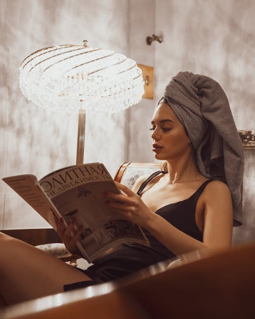 Person doing gentle seated stretch at home with soft lighting.
